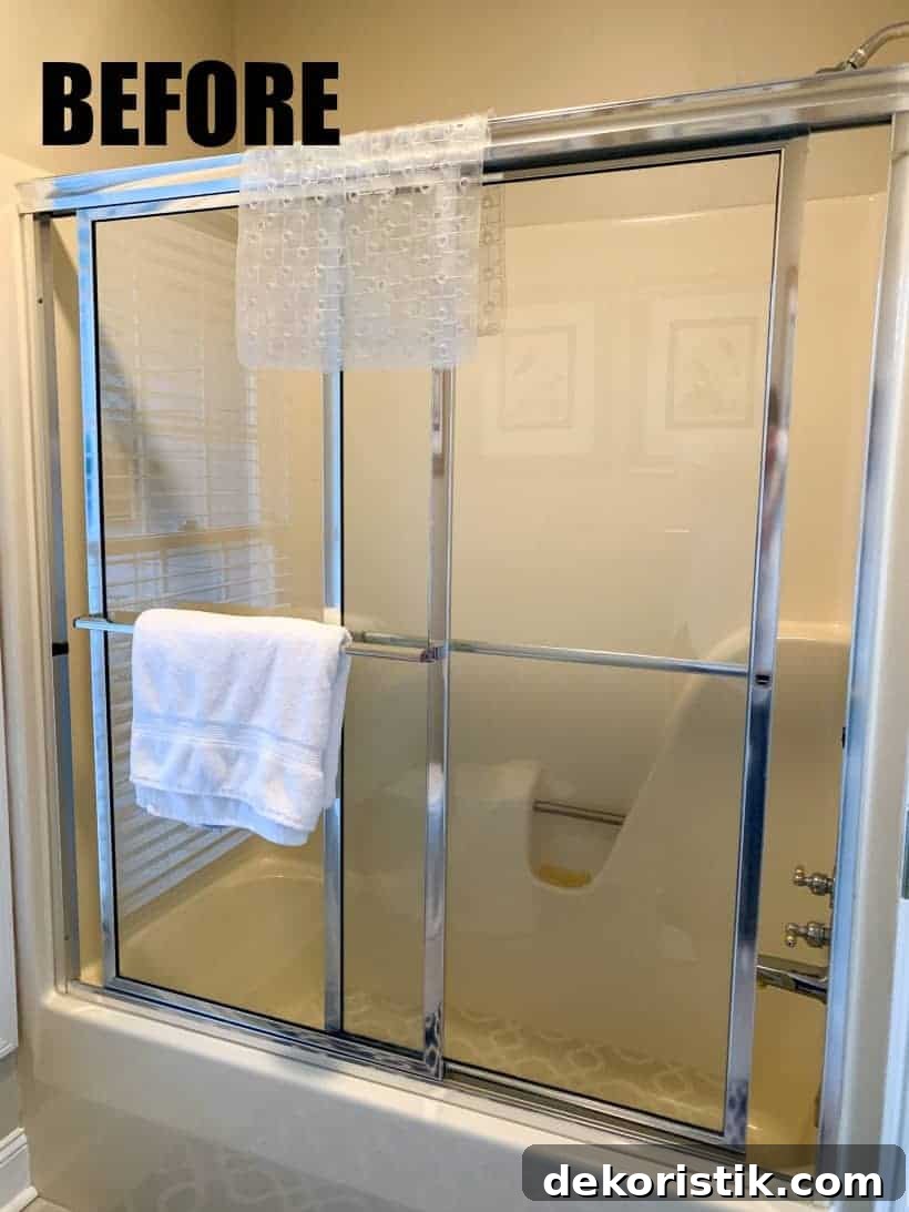 bathtub with glass shower doors