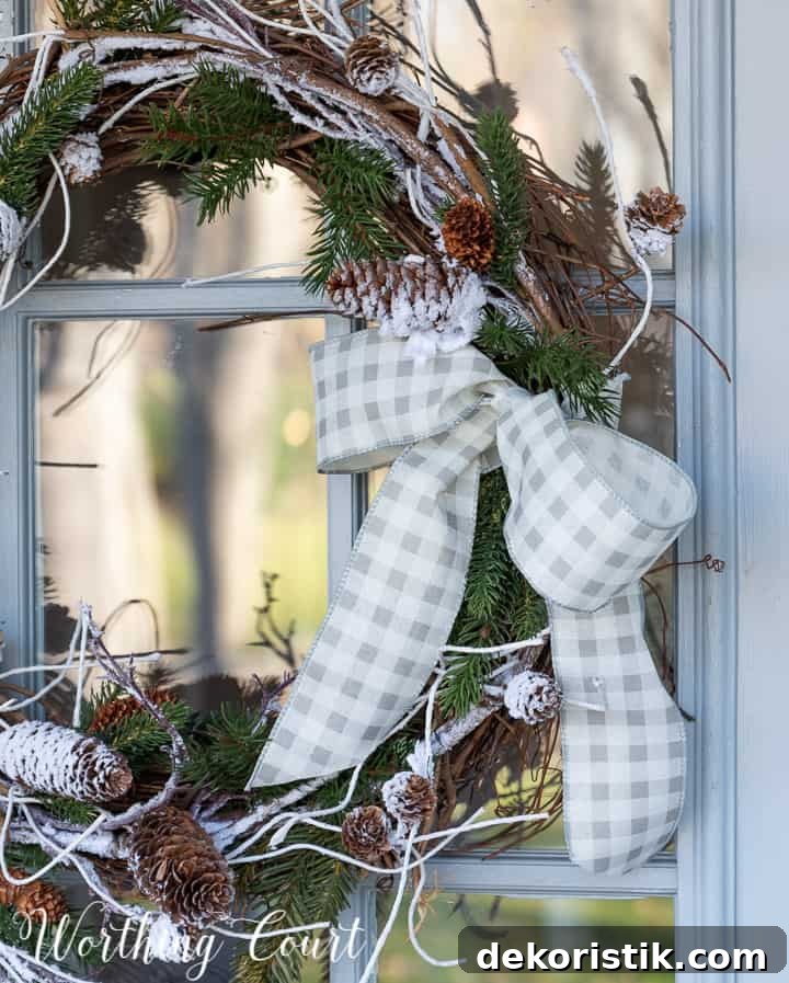 gray and white checked ribbon bow on a grapevine wreath