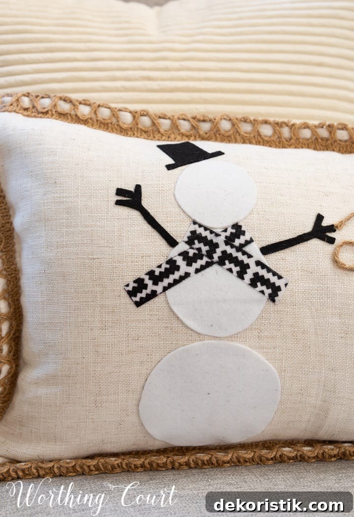closeup of felt snowman on a pillow
