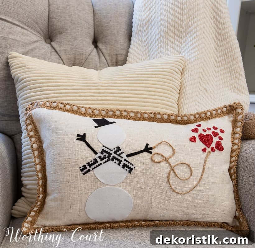 pillow with snowman and red hearts in a gray chair