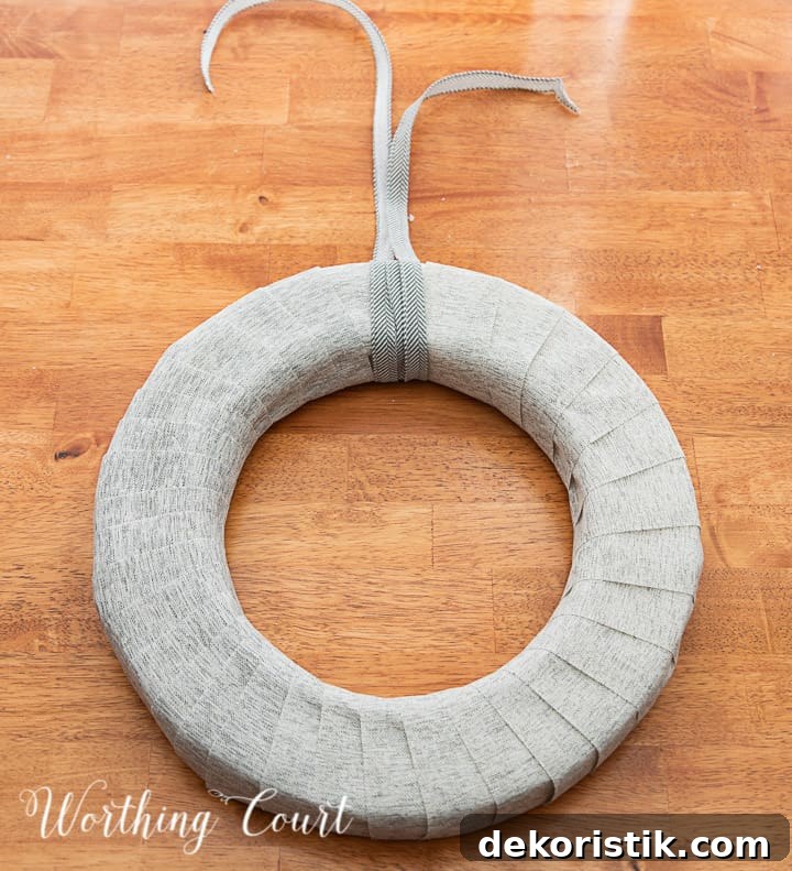In process photo of tutorial about how to make a Valentine's Day wreath with yarn balls