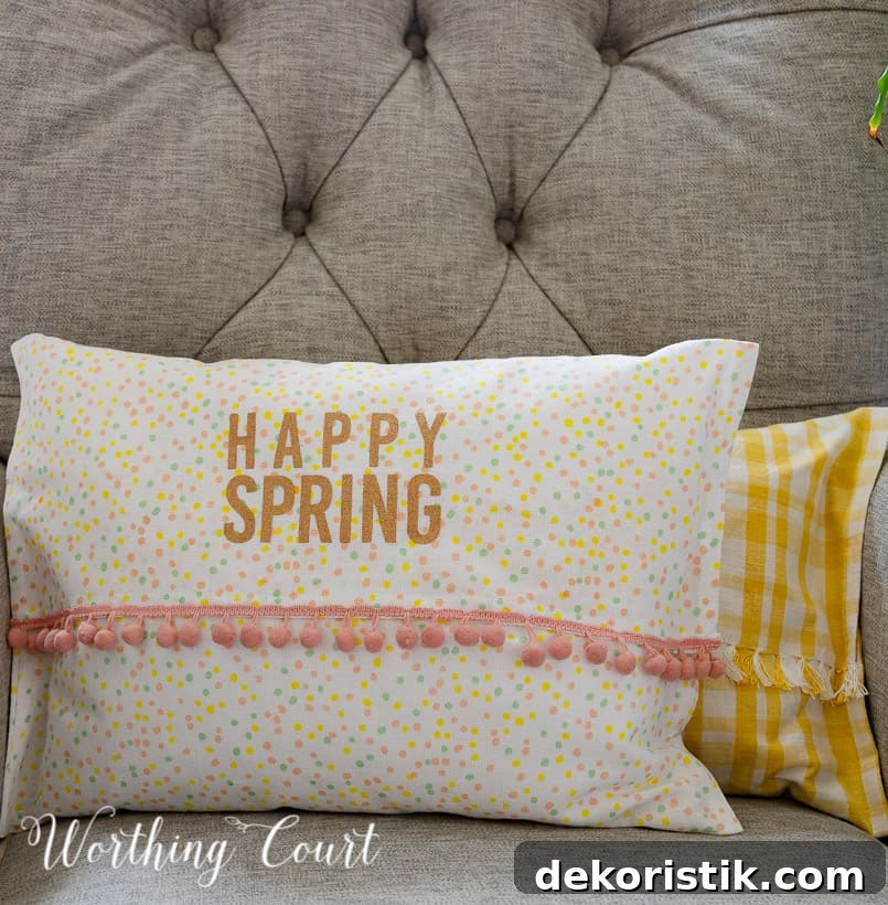 yellow and white and multi colored dots pillows in a gray chair