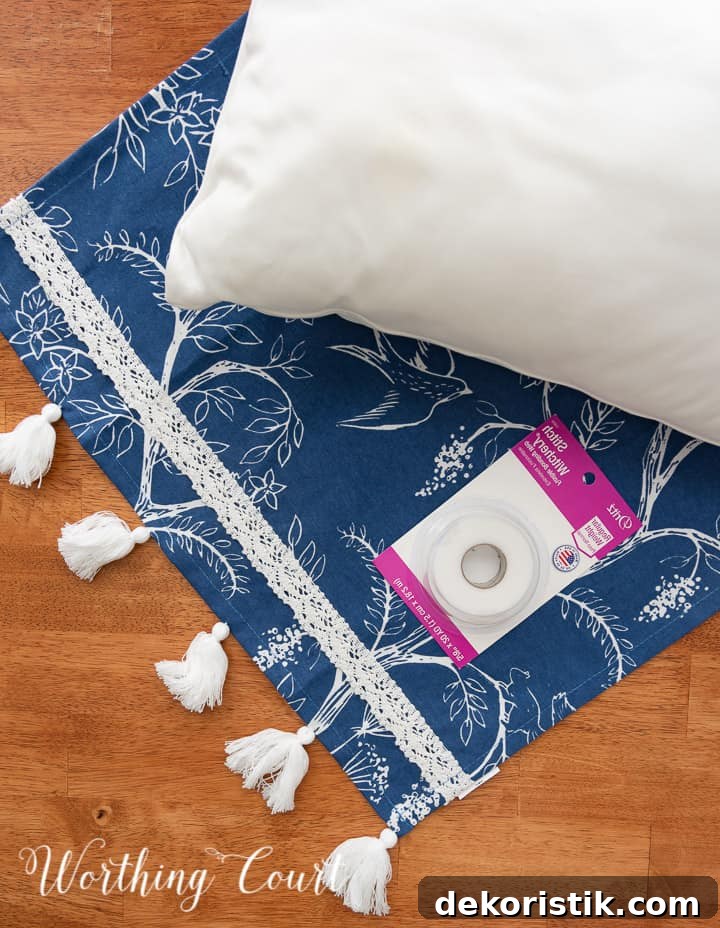 supplies needed to make a no sew pillow cover - dish towel, pillow insert and fusible hem tape