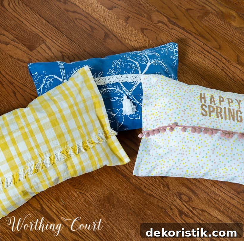3 multicolored pillows lying in a group on a wood floor