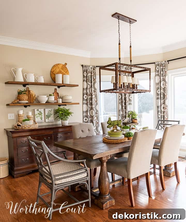 breakfast room with open wall shelves over a sideboard and spring decorations