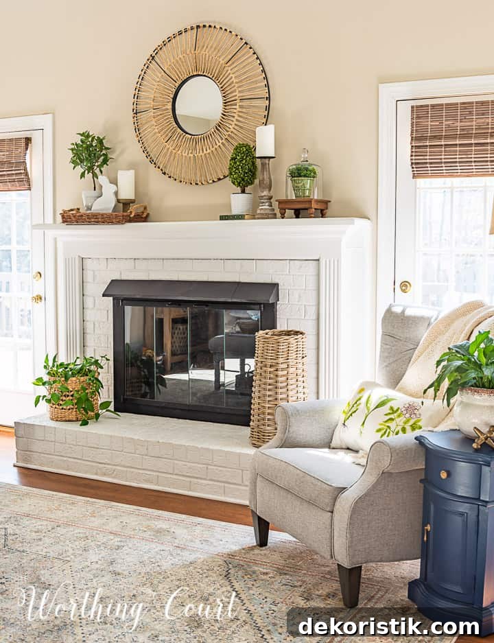 gray chair beside white fireplace with spring decorations on the mantle
