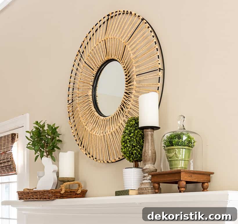 fireplace mantle with a round mirror above and spring decorations on each end