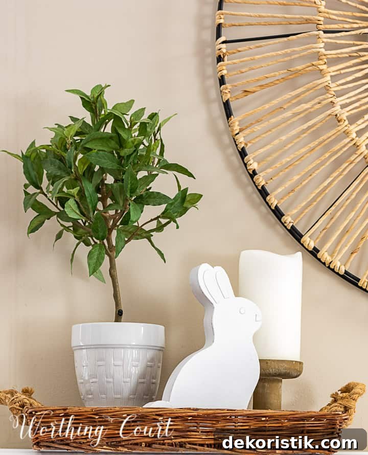 spring vignette in a tray with a topiary, candle and white bunny
