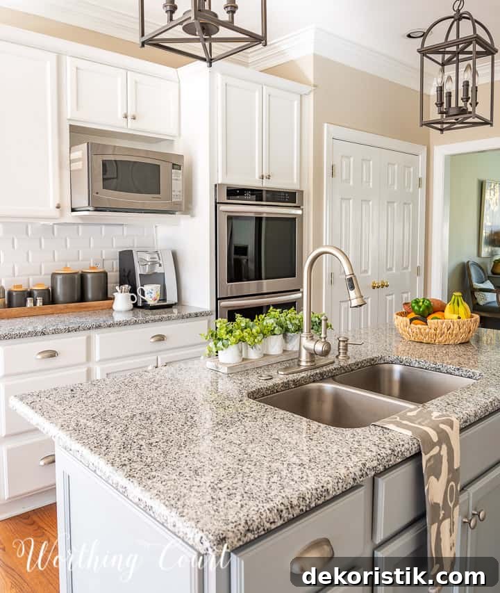 view of kitchen with white cabinets and gray island