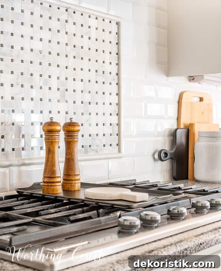 wood salt and pepper mill and marble spoon rest on top of burner griddle