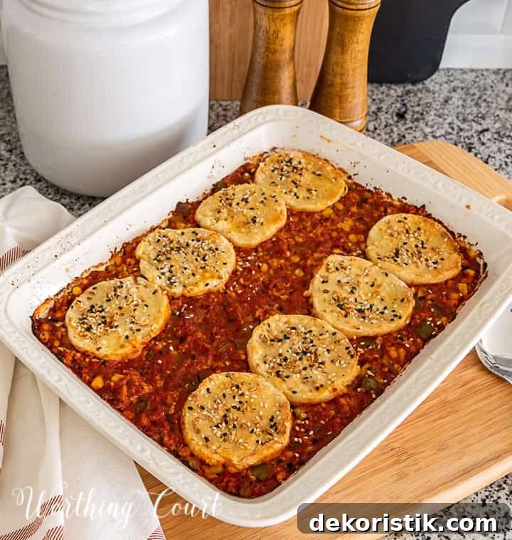 image of sloppy joe casserole topped with biscuits