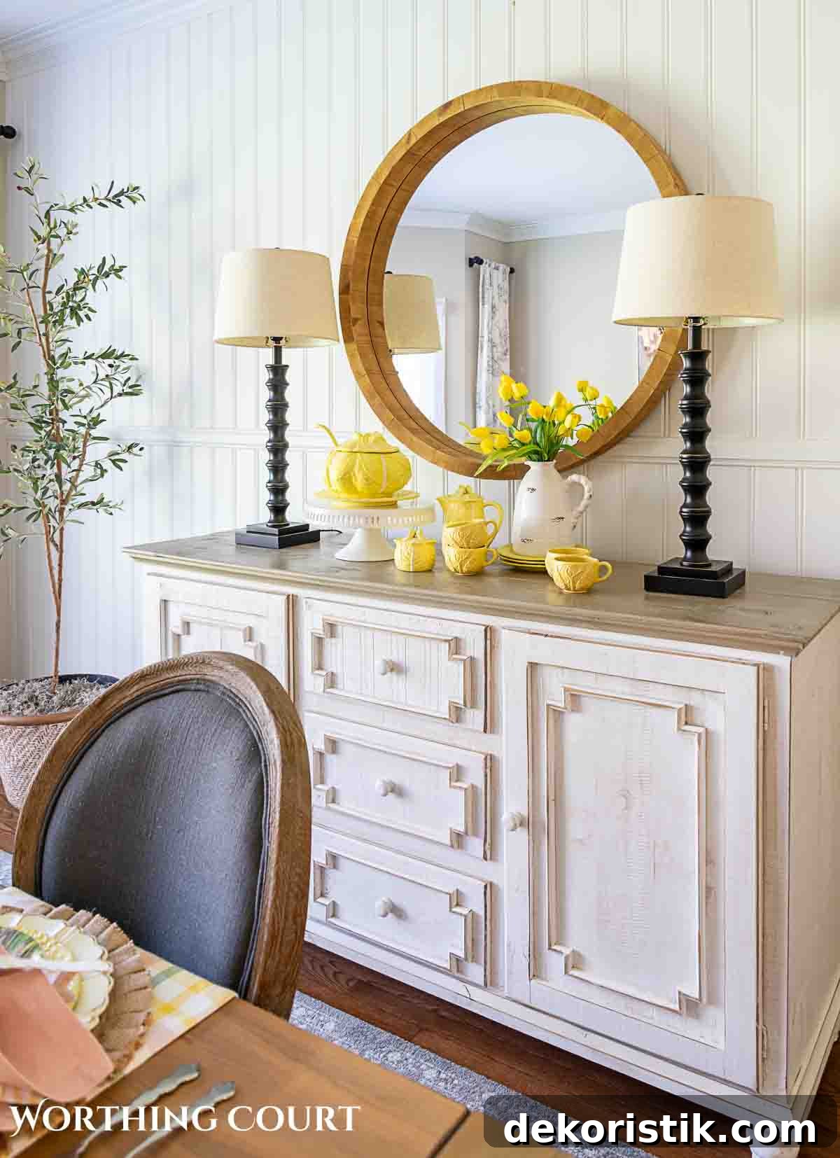 Yellow cabbage ware dishes on a white sideboard