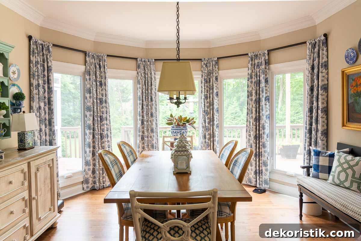 DIY Window Decor Ideas: Step-by-Step Tutorials 21 large floor to ceiling bay window in a breakfast room decorated with blue and white