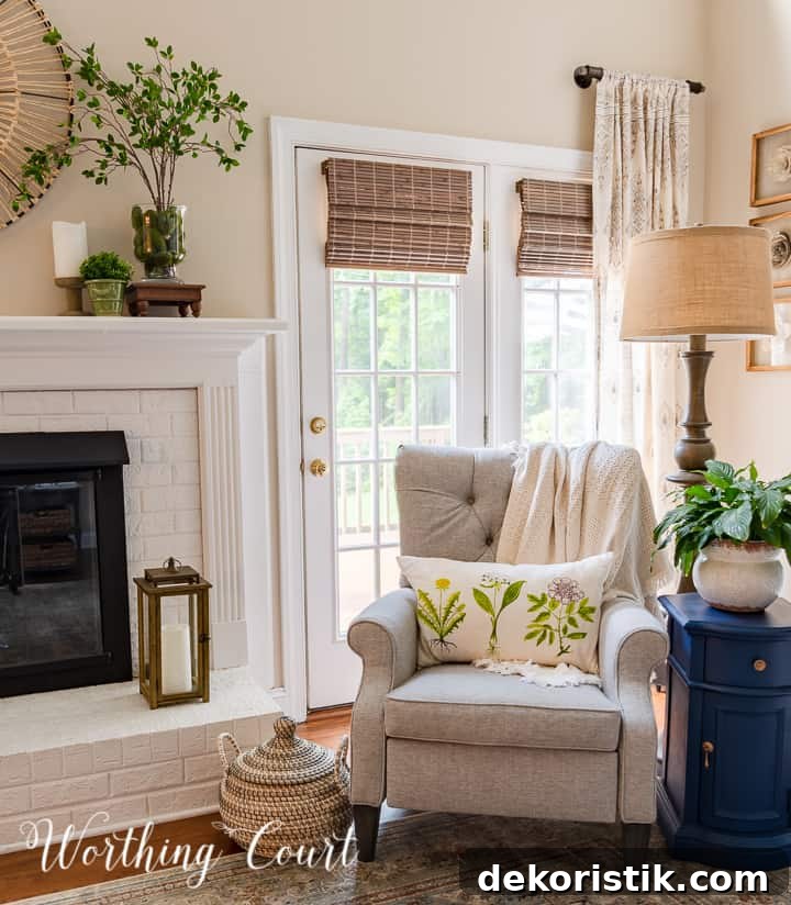 gray tufted recliner beside white brick fireplace
