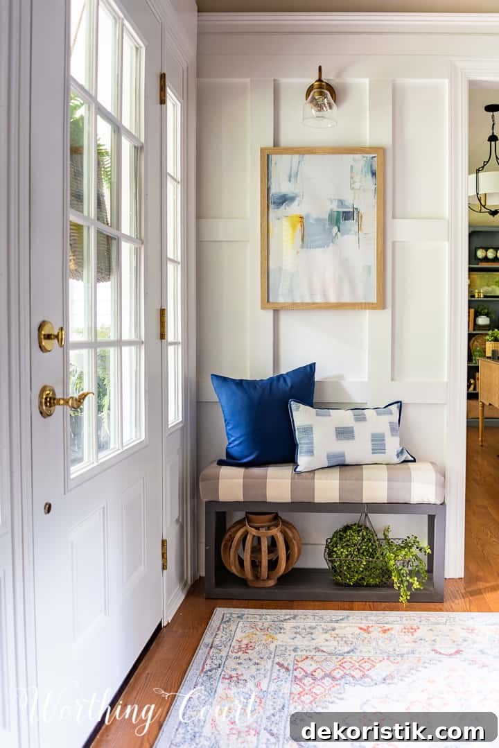 bench in front of white board and batten wall with artwork