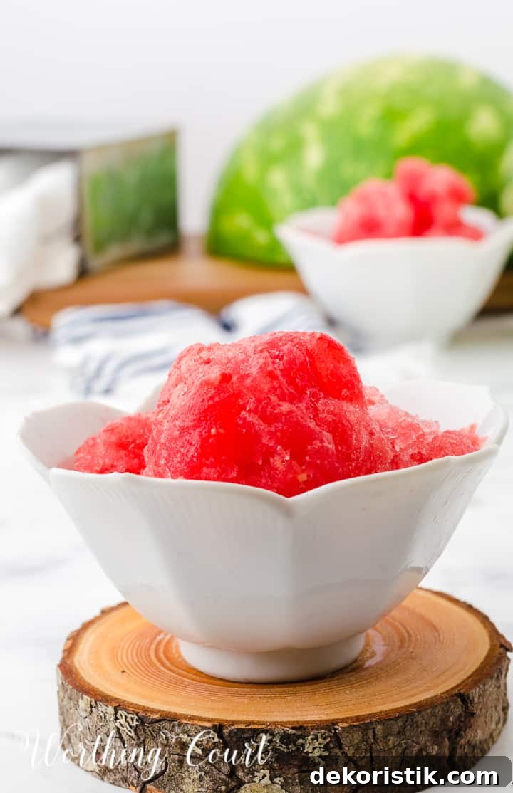 two white bowls filled with watermelon sorbet on top of a wood piece