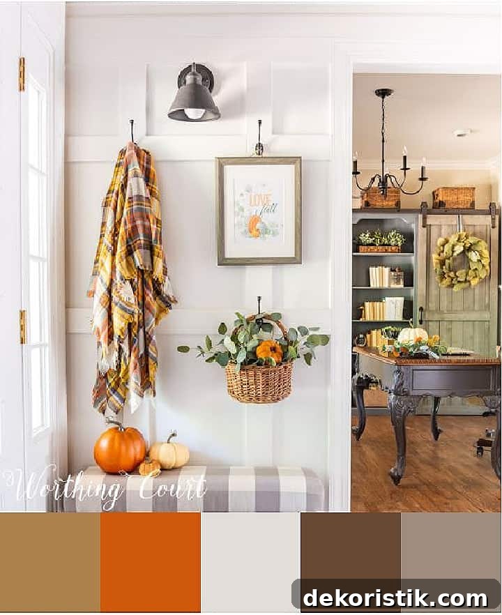 white wall with fall decorations hanging from hooks