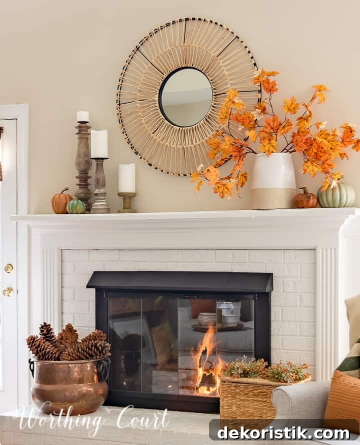 white mantel with round mirror above and fall decorations