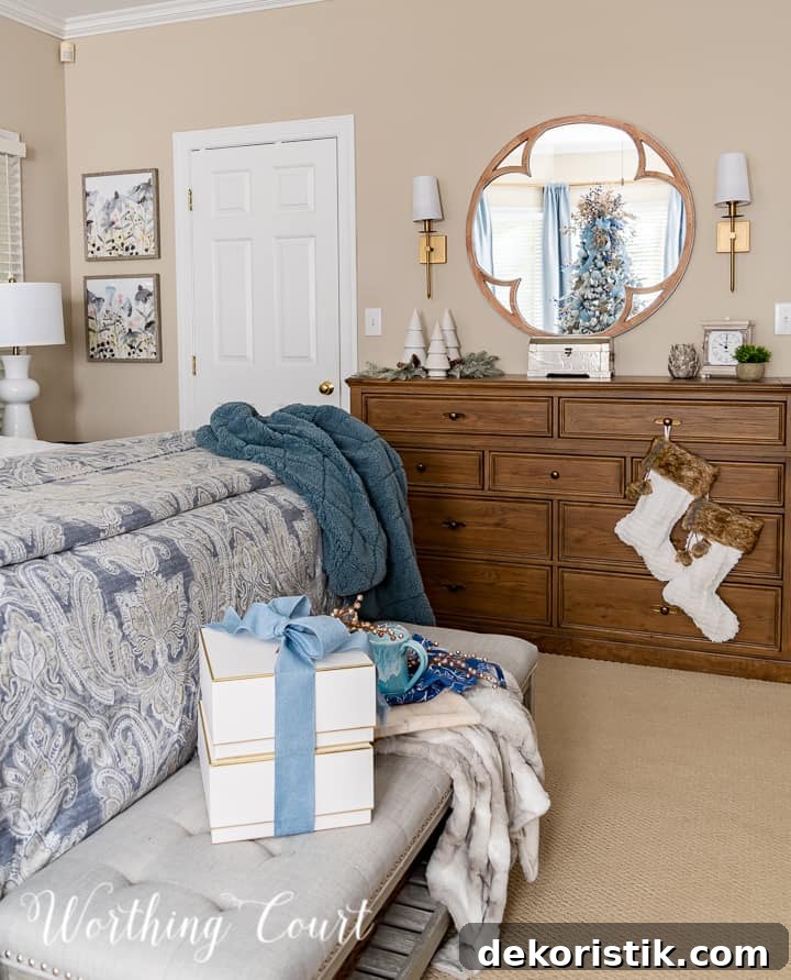 Bedroom dresser with stockings hanging from handles and other various Christmas decorations