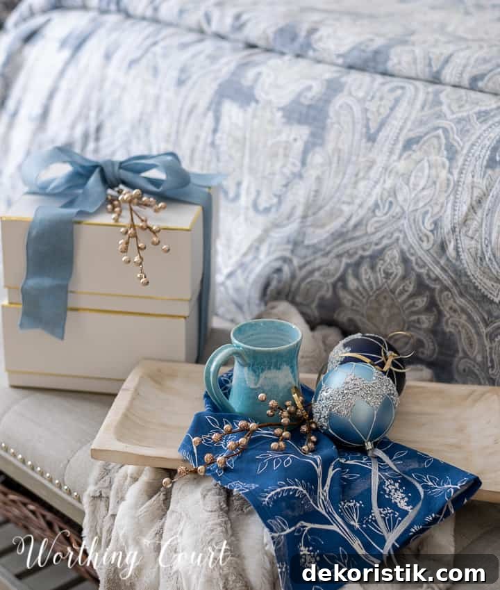 Christmas gifts on a bench with a tray with coffee mug and blue ornaments