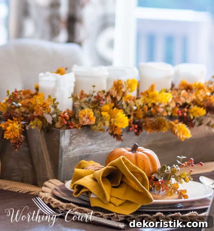 Place setting with mini cutting board, golden pumpkin and fall foliage