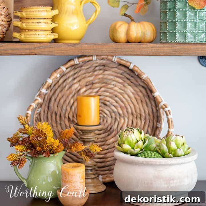 Fall vignette on a sideboard with amber, gold and green accessories