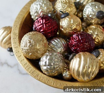 bowl of burgundy gold and silver Christmas ornaments
