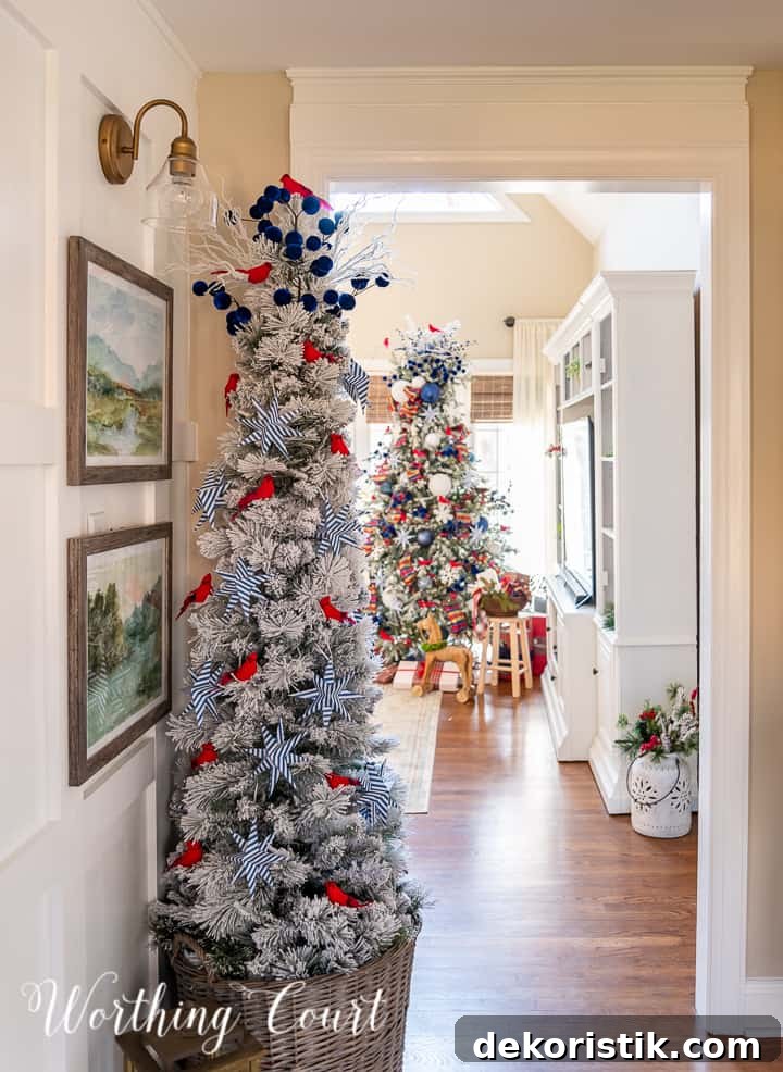view through foyer of 2 Christmas trees