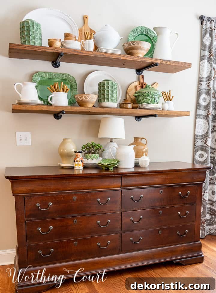 open wood shelves decorated with green, white and natural wood accessories