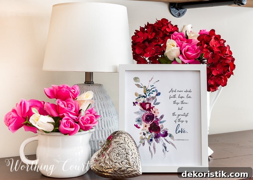 I've mentioned before that I don't do a lot of decorating for the annual day of love, so to keep it simple I created a little Valentine'ish vignette on the sideboard in my kitchen. It's located in a very visible spot, so the printable, combined with a few faux florals, adds just the right bit of a romantic touch.