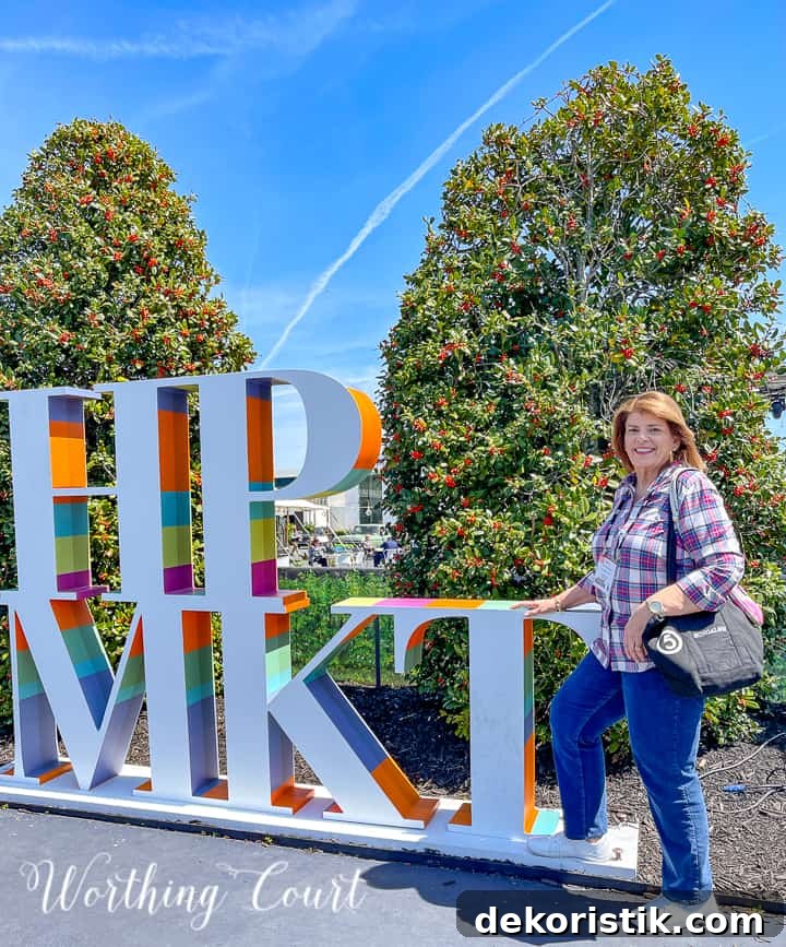 woman in front of a sign