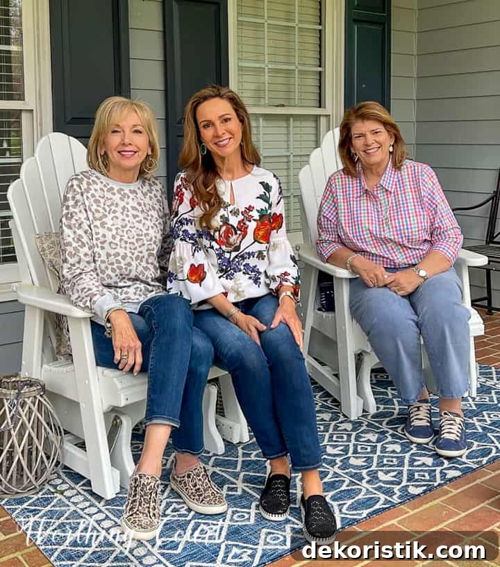 3 women sitting in chairs on a porch