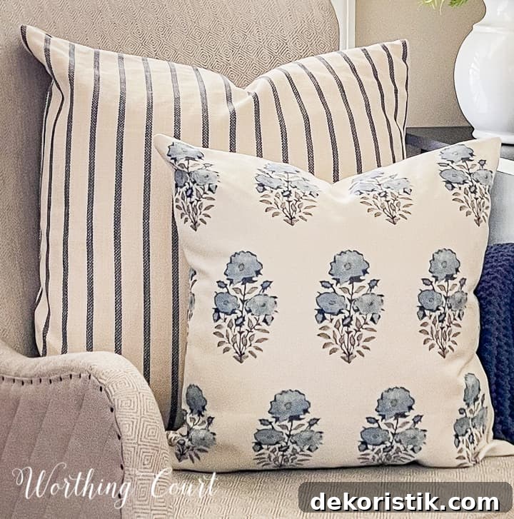 blue and white pillows in a gray chair