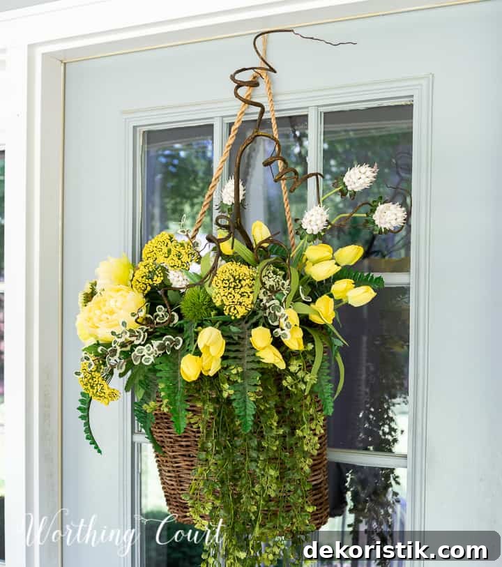 hanging basket filled with yellow flowers and greenery