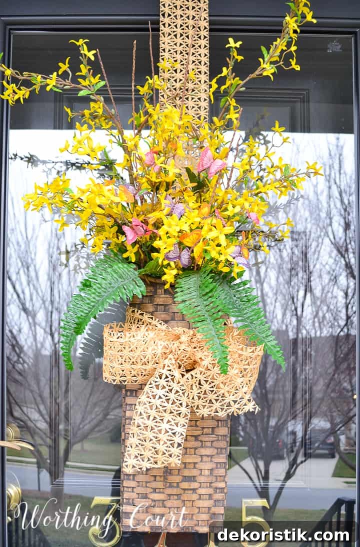hanging basket filled with yellow flowers and greenery