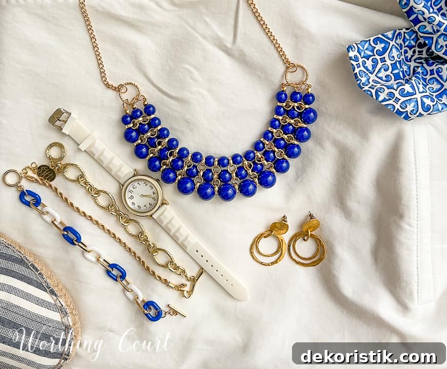 image of blue and gold jewelry lying on a white background
