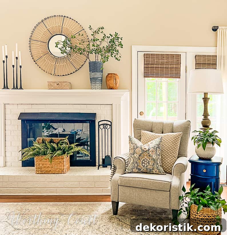 white brick fireplace decorated for summer with an arm chair beside it