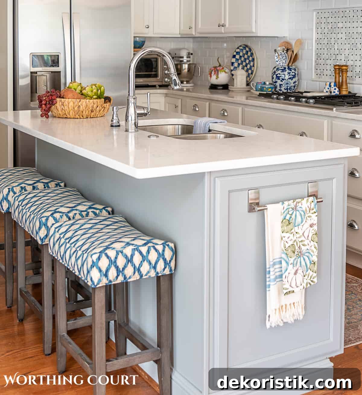fall kitchen decor on a gray island with three counter height stools