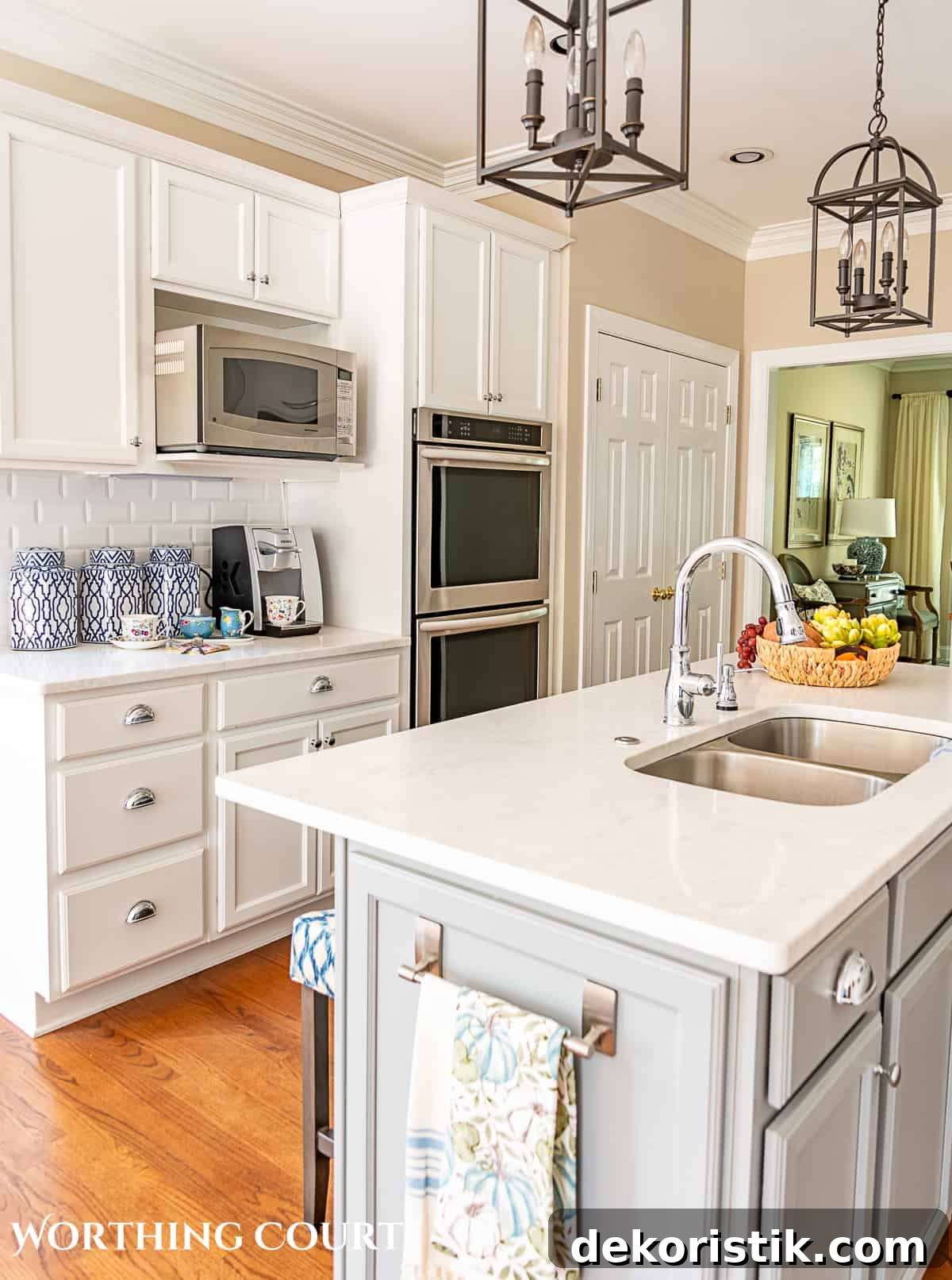 blue and white fall decorations in a kitchen with white cabinets