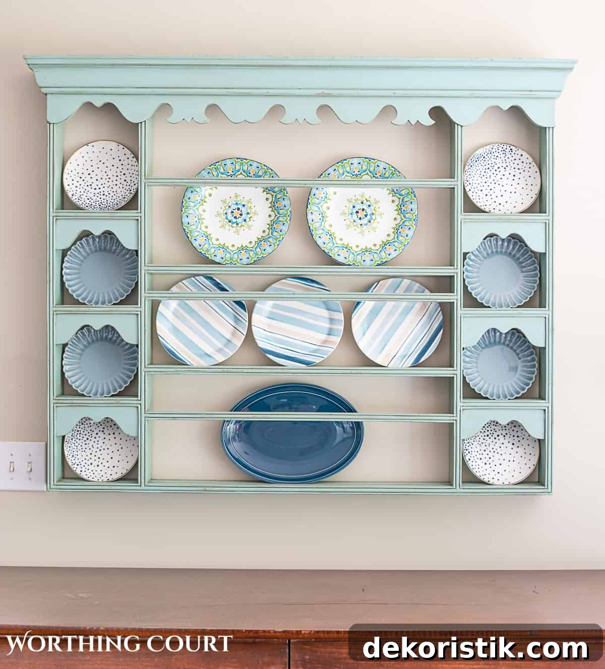 blue plate rack with blue and white dishes and tips for how to decorate a plate display rack with your favorite items