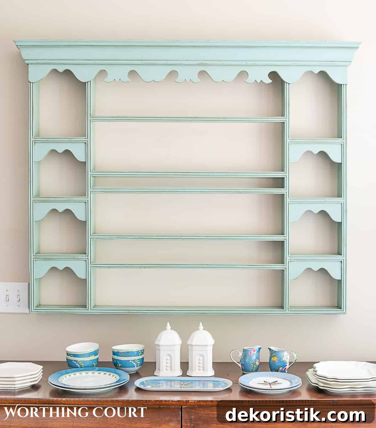 blue plate rack with blue and white dishes and tips for how to decorate a plate display rack with your favorite items