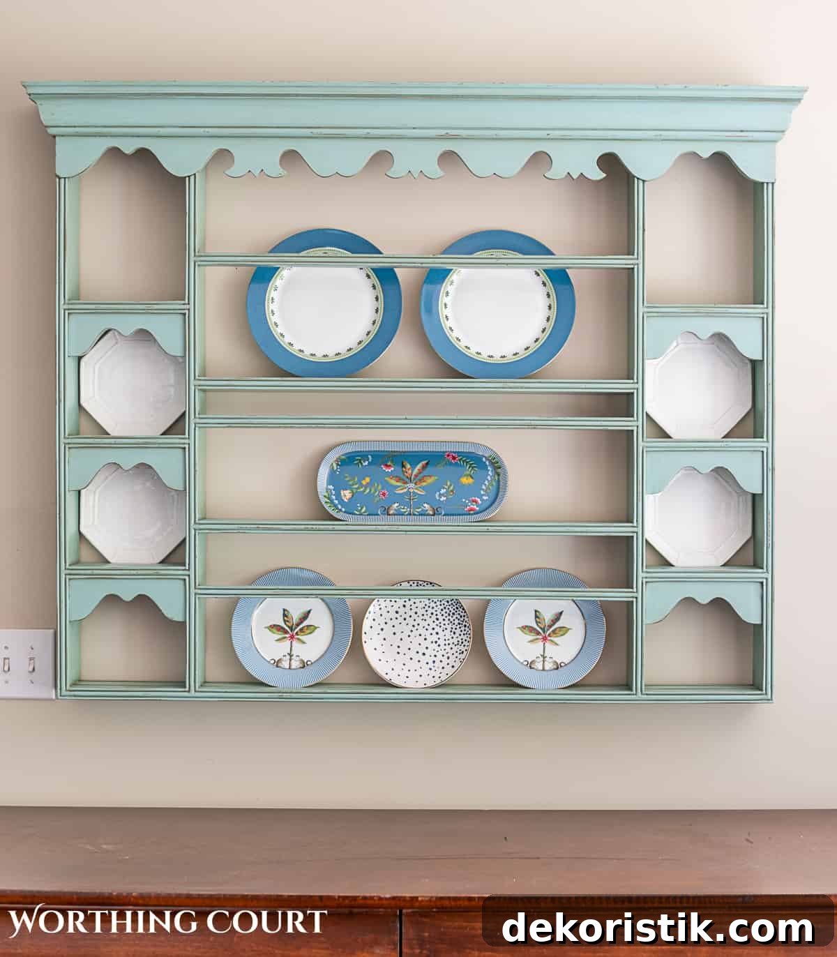 blue plate rack with blue and white dishes and tips for how to decorate a plate display rack with your favorite items