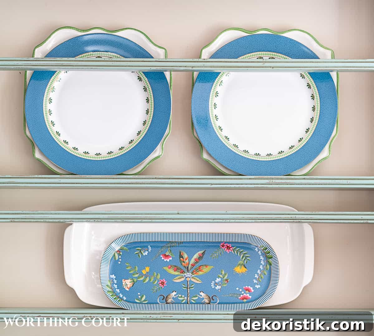 blue plate rack with blue and white dishes and tips for how to decorate a plate display rack with your favorite items