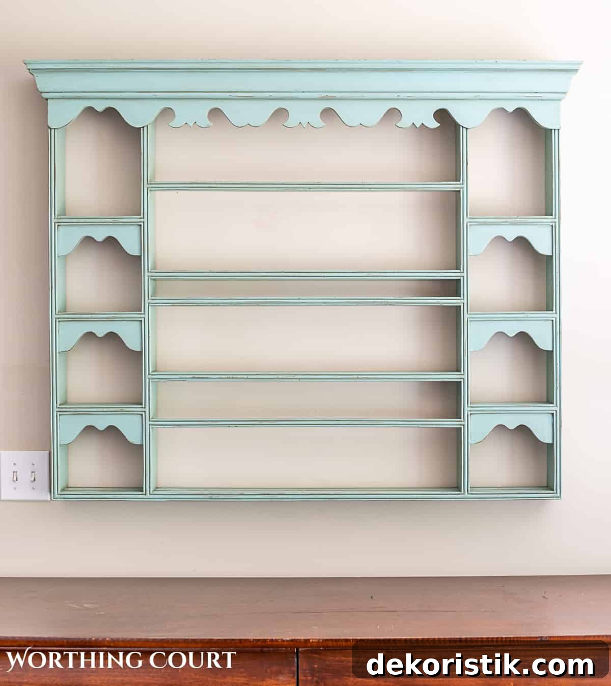 blue plate rack with blue and white dishes and tips for how to decorate a plate display rack with your favorite items