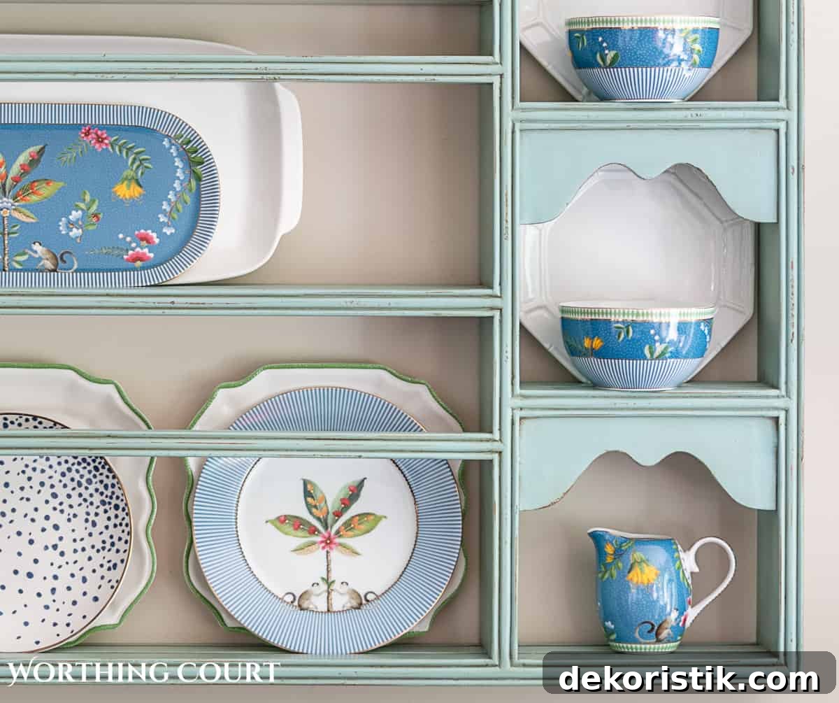 blue plate rack with blue and white dishes and tips for how to decorate a plate display rack with your favorite items