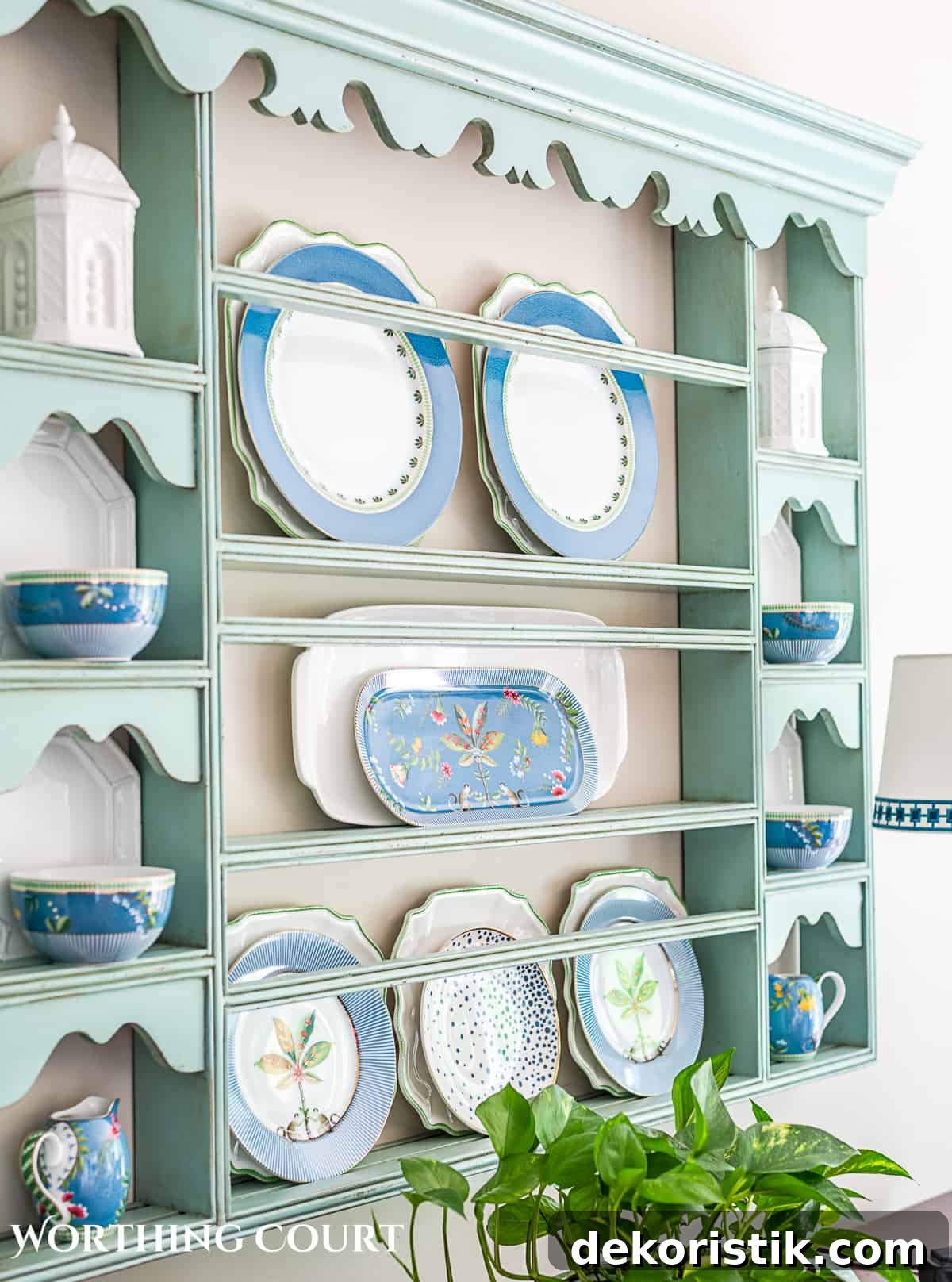 blue plate rack with blue and white dishes and tips for how to decorate a plate display rack with your favorite items