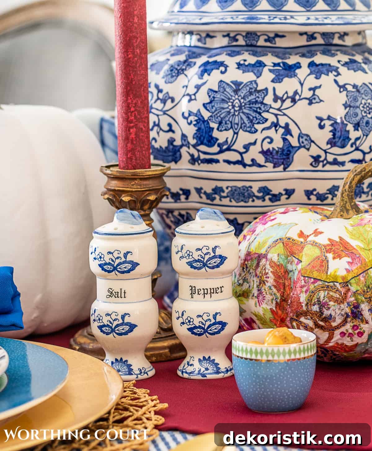 blue and white thanksgiving table setting with touches of burgundy