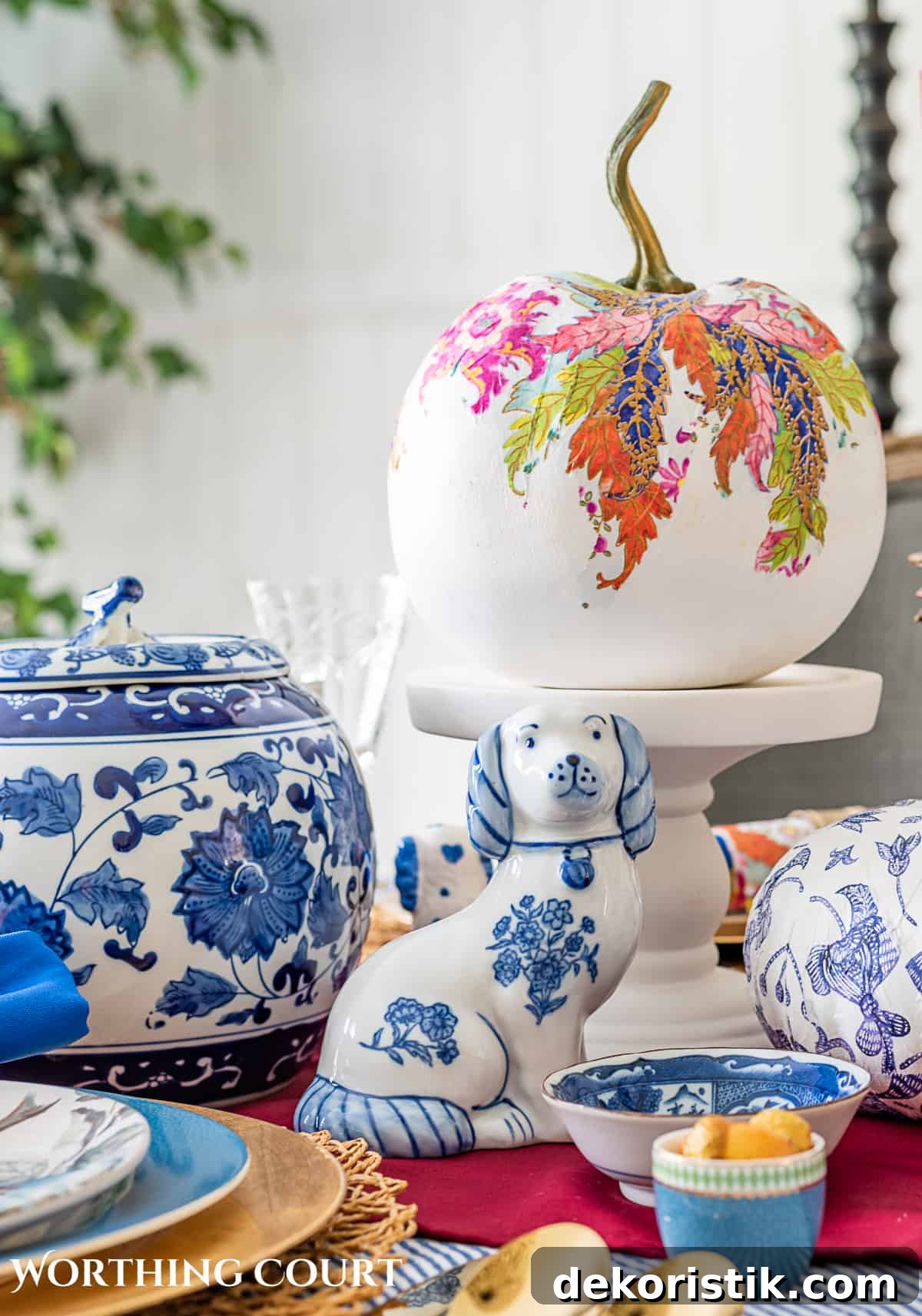 blue and white thanksgiving table setting with touches of burgundy