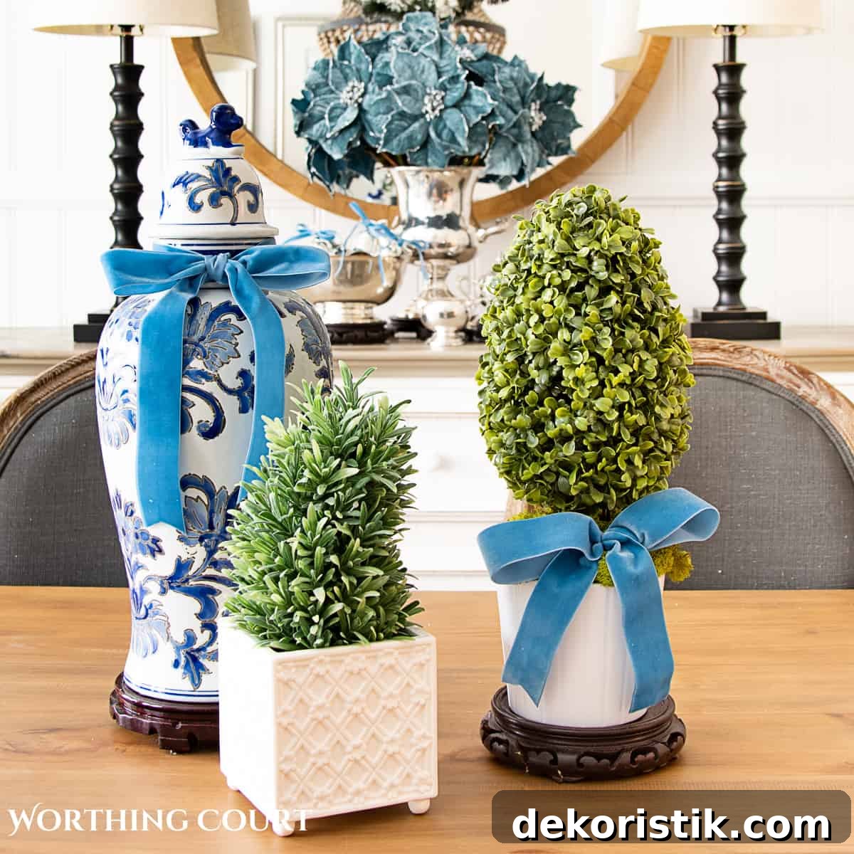 Christmas centerpiece with blue and white ginger jar and topiaries accented with French blue ribbon