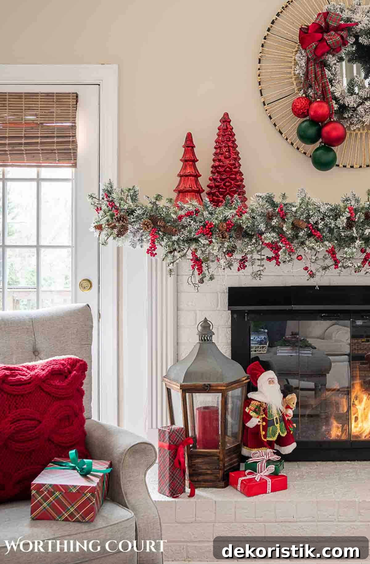Christmas tree, fireplace and living room decorated for Christmas with red green and gold decorations